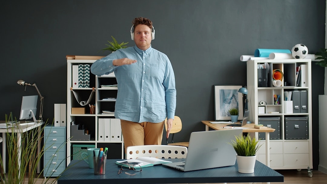 Desk worker stretching during a workday