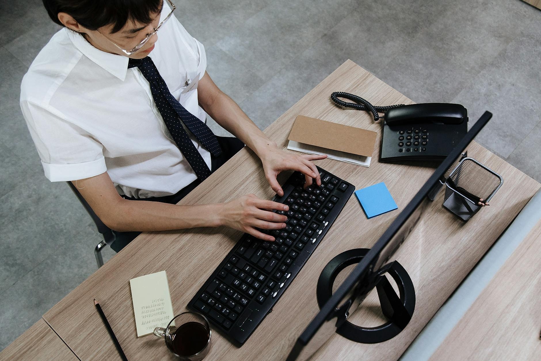 Office worker doing a simple stretch at desk